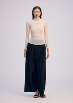 A model wears the Issey Miyake CHIFFON TWIST BKWT 66 shirt.