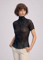 A model wears the Issey Miyake CHIFFON TWIST BKWT 66 shirt.