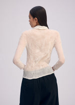 A model wears the Issey Miyake CHIFFON TWIST BKWT 66 shirt.
