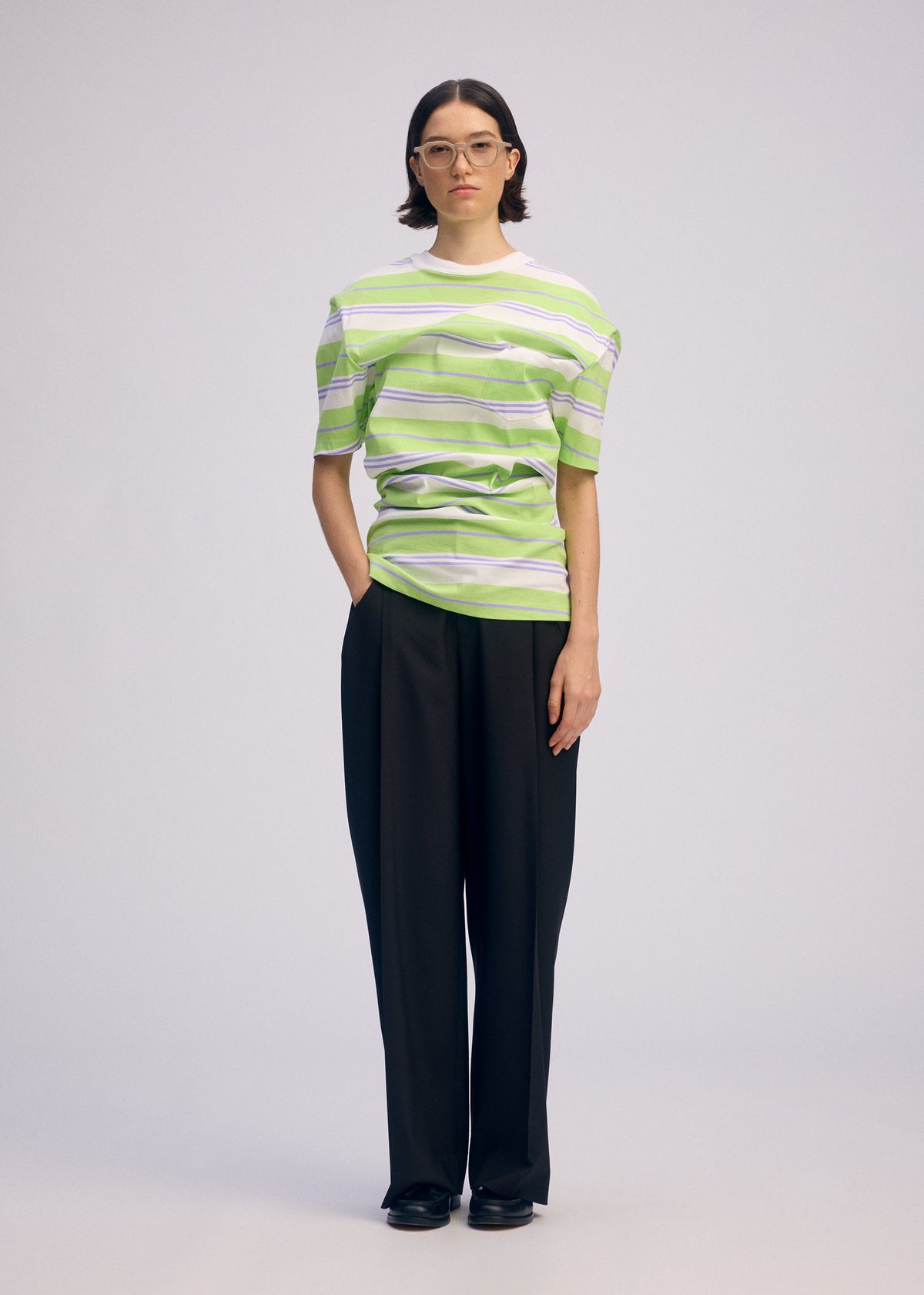 A model wears the Issey Miyake GENERIC WEAR?STRIPES prêt à porter.