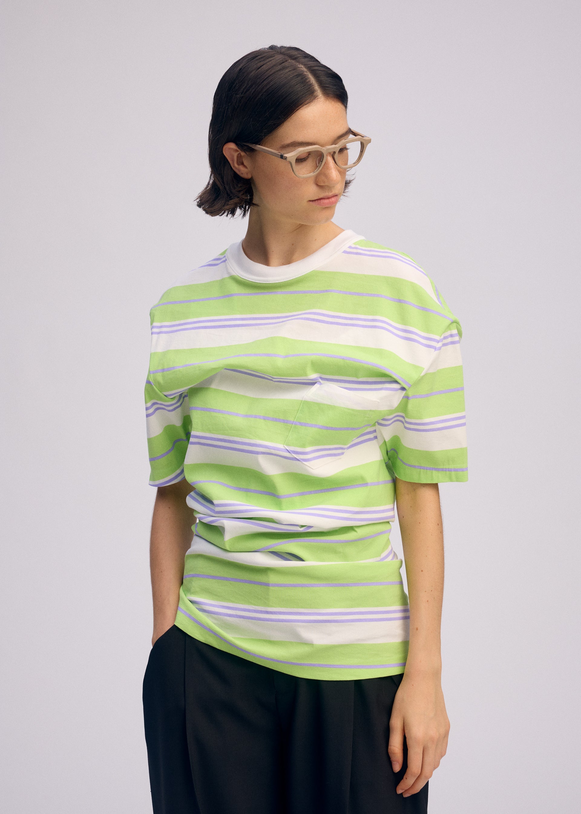 A model wears the Issey Miyake GENERIC WEAR?STRIPES prêt à porter.