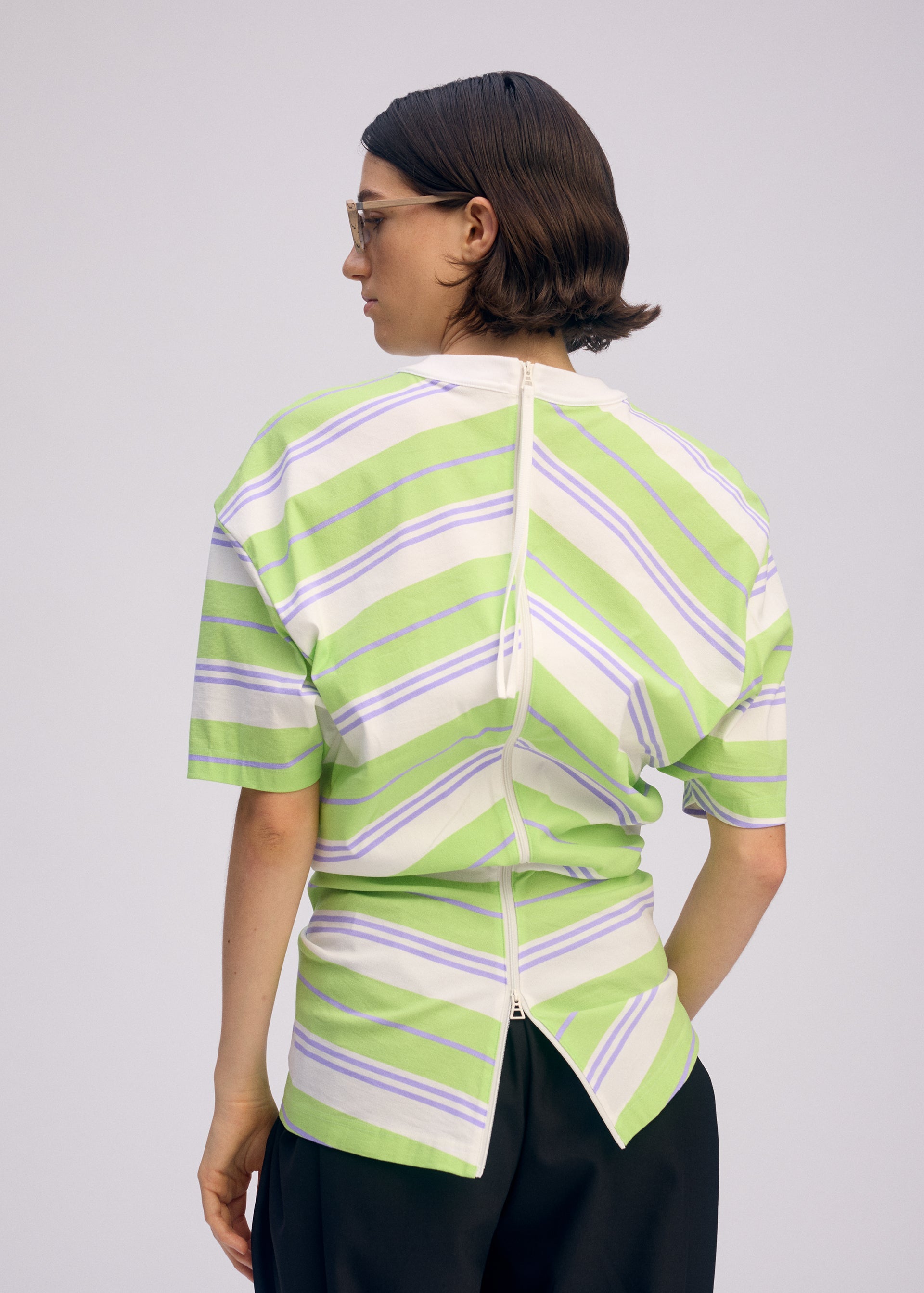 A model wears the Issey Miyake GENERIC WEAR?STRIPES prêt à porter.