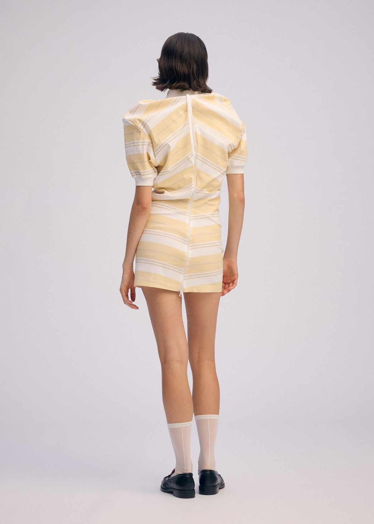A model wears the Issey Miyake GENERIC WEAR?STRIPES prêt à porter.