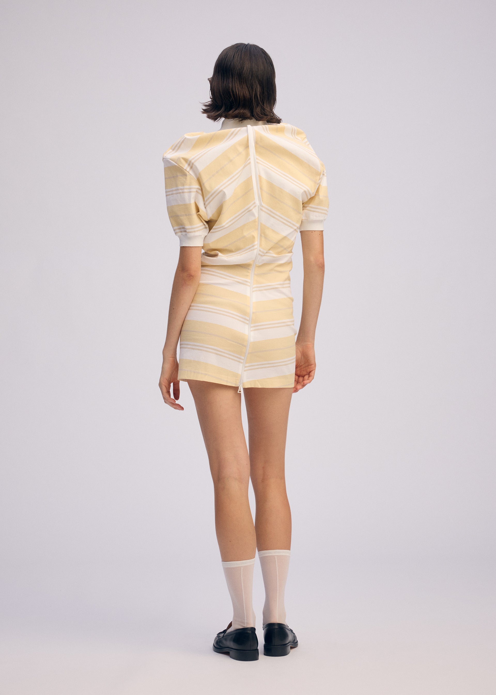 A model wears the Issey Miyake GENERIC WEAR?STRIPES prêt à porter.