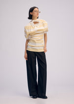 A model wears the Issey Miyake GENERIC WEAR?STRIPES prêt à porter.