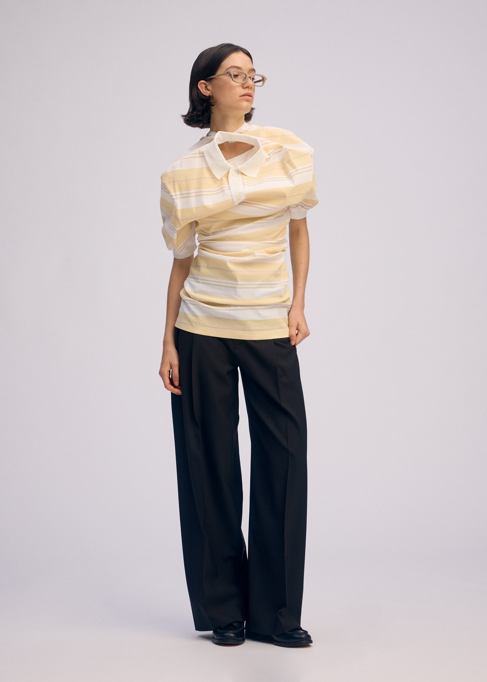 A model wears the Issey Miyake GENERIC WEAR?STRIPES prêt à porter.