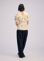 A model wears the Issey Miyake GENERIC WEAR?STRIPES prêt à porter.