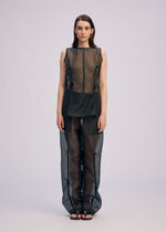 A model wears the Issey Miyake DRAW TO FORM shirt.