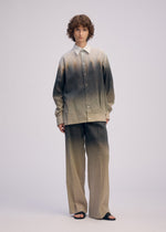 A model wears the ISSEY MIYAKE PLUMAGE plumage-shirt-chukar.