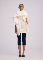 A model wears the ISSEY MIYAKE CONCEALED concealed-shirt-black.