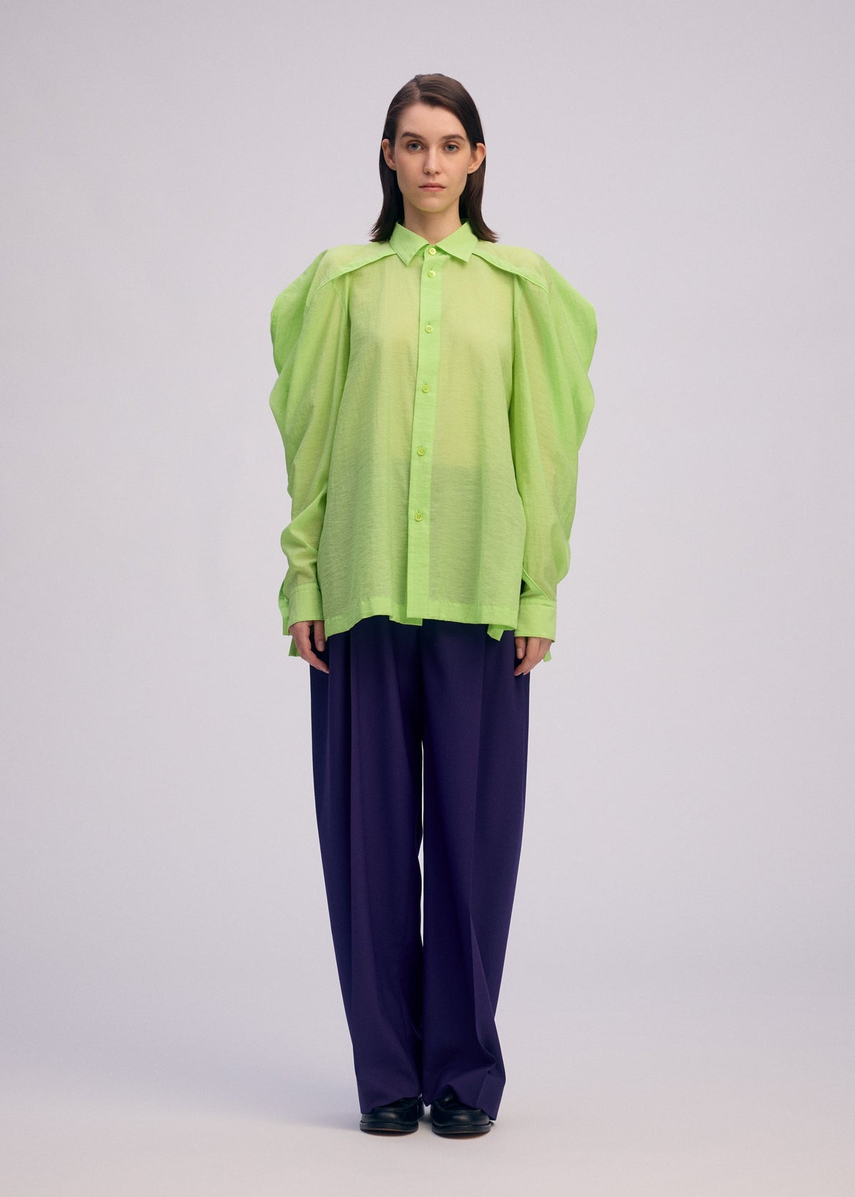 A model wears the Issey Miyake R SHIRT SHEER prêt à porter.
