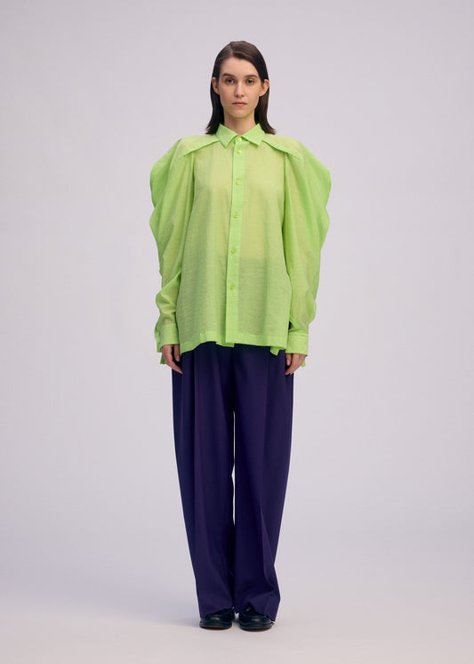 A model wears the Issey Miyake R SHIRT SHEER prêt à porter.