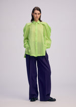 A model wears the Issey Miyake R SHIRT SHEER prêt à porter.