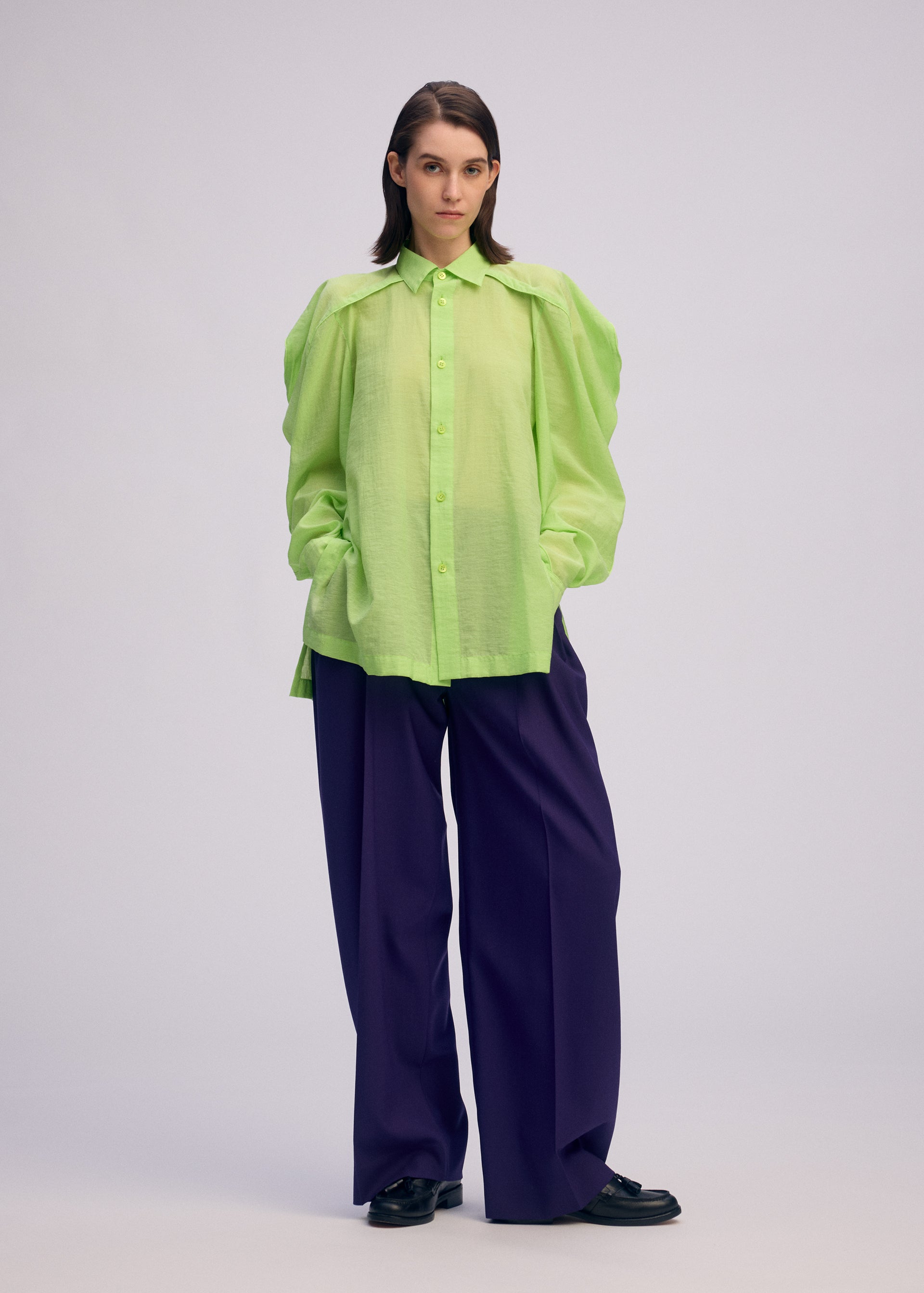 A model wears the Issey Miyake R SHIRT SHEER prêt à porter.