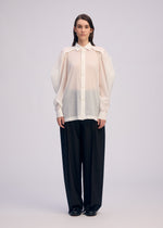 A model wears the Issey Miyake R SHIRT SHEER prêt à porter.