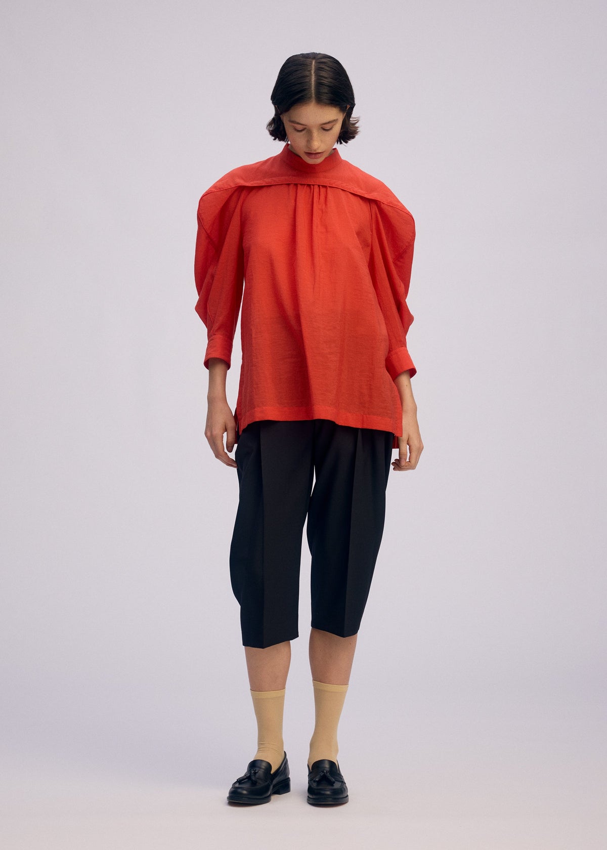 A model wears the Issey Miyake R SHIRT SHEER prêt à porter.