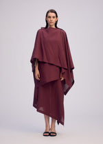 A model wears the ISSEY MIYAKE ALL SQUARES shirt.