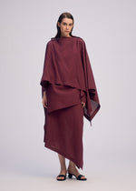 A model wears the ISSEY MIYAKE ALL SQUARES shirt.