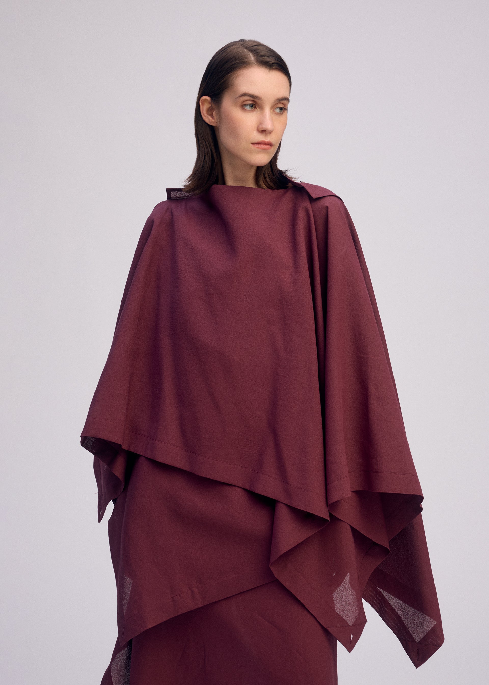 A model wears the ISSEY MIYAKE ALL SQUARES shirt.