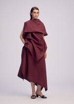 A model wears the ISSEY MIYAKE ALL SQUARES shirt.