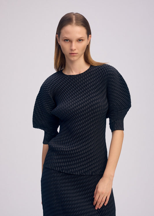 A model wears the ISSEY MIYAKE SLEEK PLEATS sleek-pleats-shirt-grey.