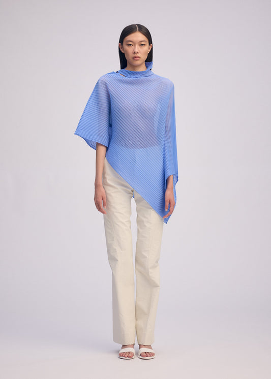 A model wears the ISSEY MIYAKE SHEER SCARF PLEATS prêt à porter.