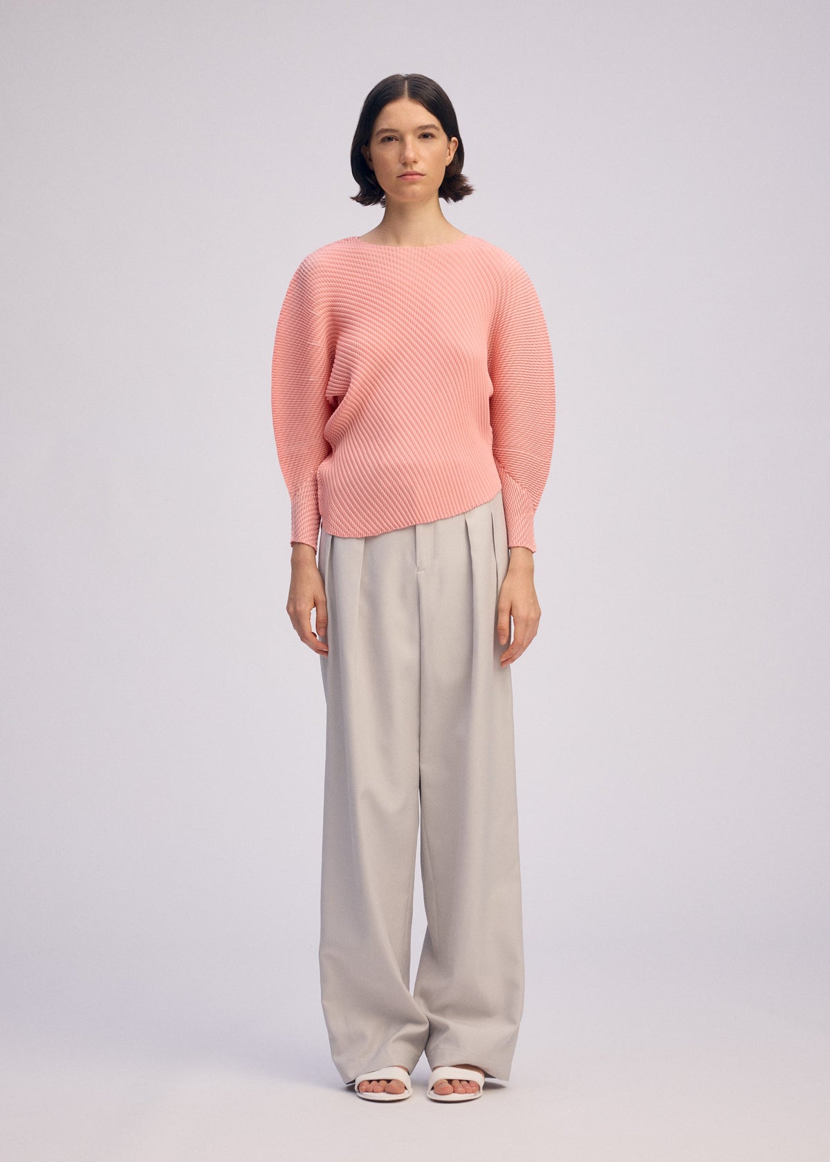 A model wears the ISSEY MIYAKE MISTY PLEATS misty-pleats-shirt-burgundy-2.