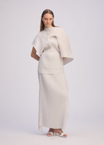A model wears the ISSEY MIYAKE PLEATED ON PLEATS shirt.