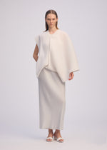 A model wears the ISSEY MIYAKE PLEATED ON PLEATS shirt.