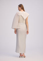 A model wears the ISSEY MIYAKE PLEATED ON PLEATS shirt.