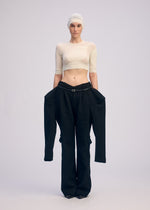 A model wears the ISSEY MIYAKE A SHOPPERS BODY prêt à porter.