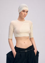 A model wears the ISSEY MIYAKE A SHOPPERS BODY prêt à porter.