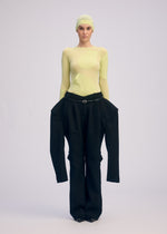 A model wears the ISSEY MIYAKE A SHOPPERS BODY prêt à porter.