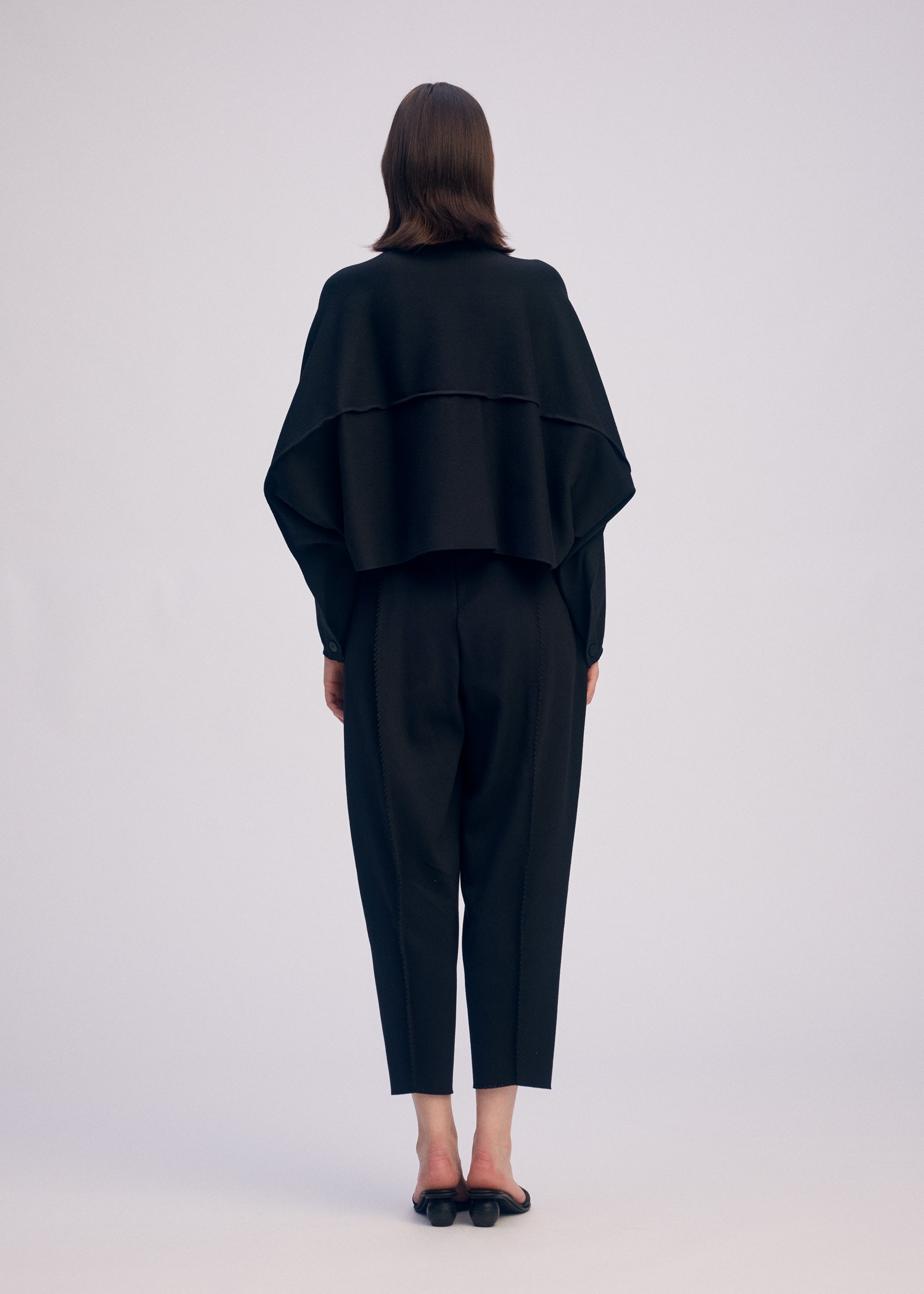 A model wears the ISSEY MIYAKE CAMPAGNE prêt à porter.