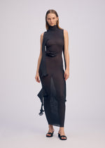 A model wears the ISSEY MIYAKE ADVENTITIOUS?SLEEVES dress.