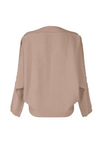 A detail shot of the ISSEY MIYAKE CAMPAGNE prêt à porter.