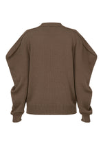 A detail shot of the ISSEY MIYAKE AKIMBO KNIT prêt à porter.