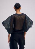 A model wears the Issey Miyake CIALDA prêt à porter.