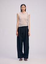 A model wears the ISSEY MIYAKE CONCEALED KNIT concealed-knit-top-black-1.
