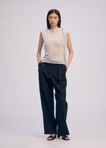 A model wears the ISSEY MIYAKE CONCEALED KNIT concealed-knit-top-light-grey-1.