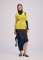 A model wears the ISSEY MIYAKE ADVENTITIOUS?SLEEVES top.