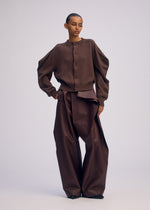 A model wears the ISSEY MIYAKE AKIMBO KNIT prêt à porter.