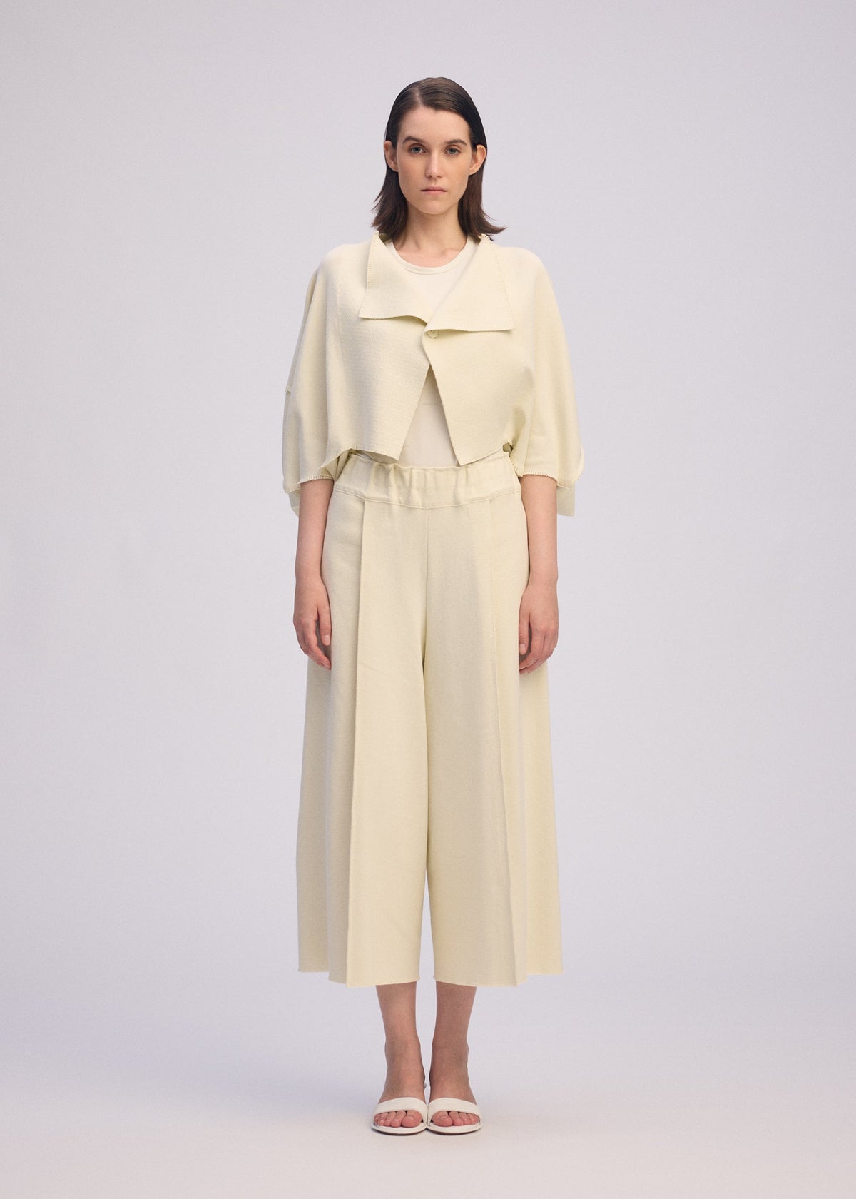 A model wears the ISSEY MIYAKE CAMPAGNE prêt à porter.