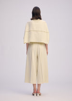 A model wears the ISSEY MIYAKE CAMPAGNE prêt à porter.