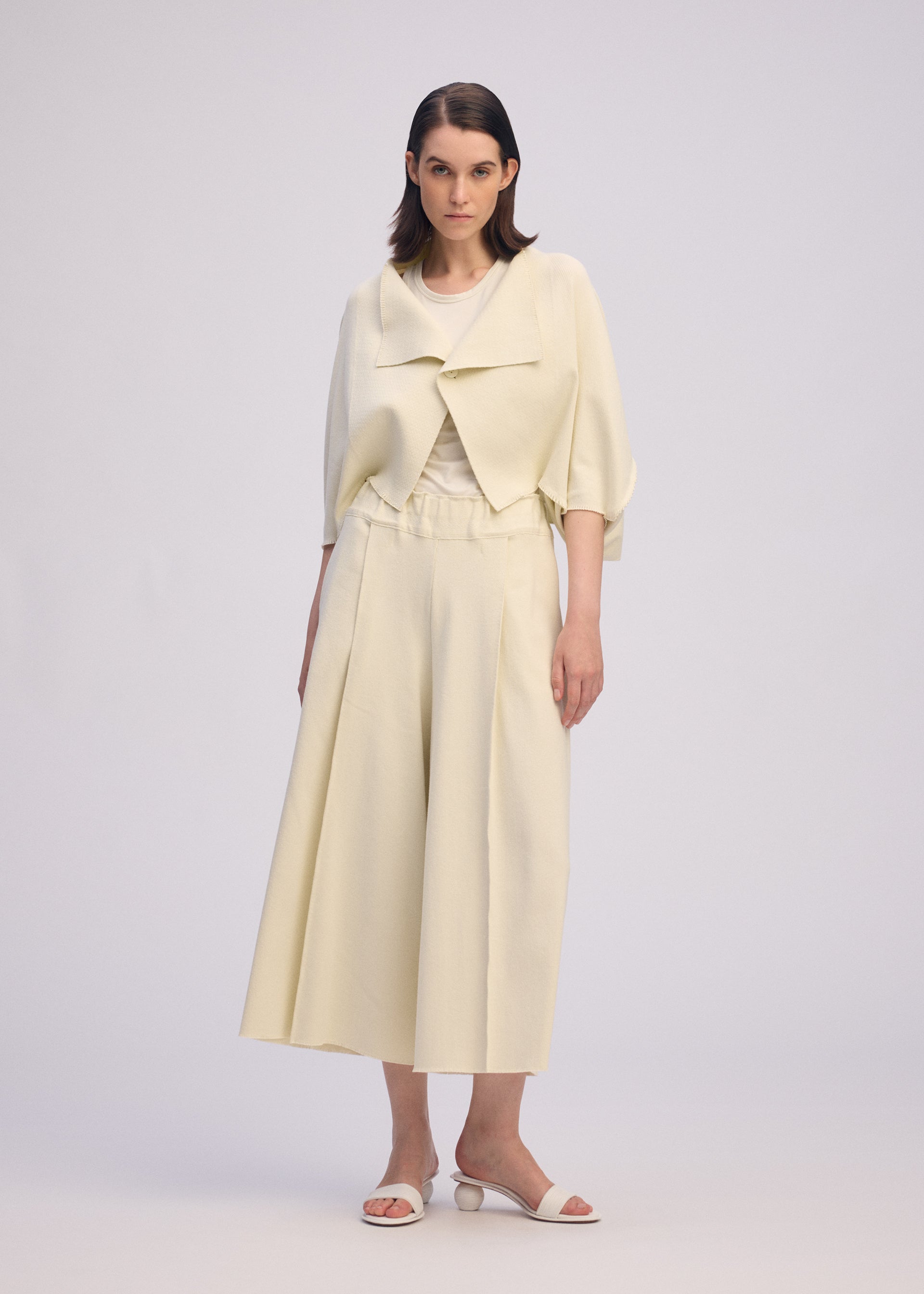 A model wears the ISSEY MIYAKE CAMPAGNE prêt à porter.