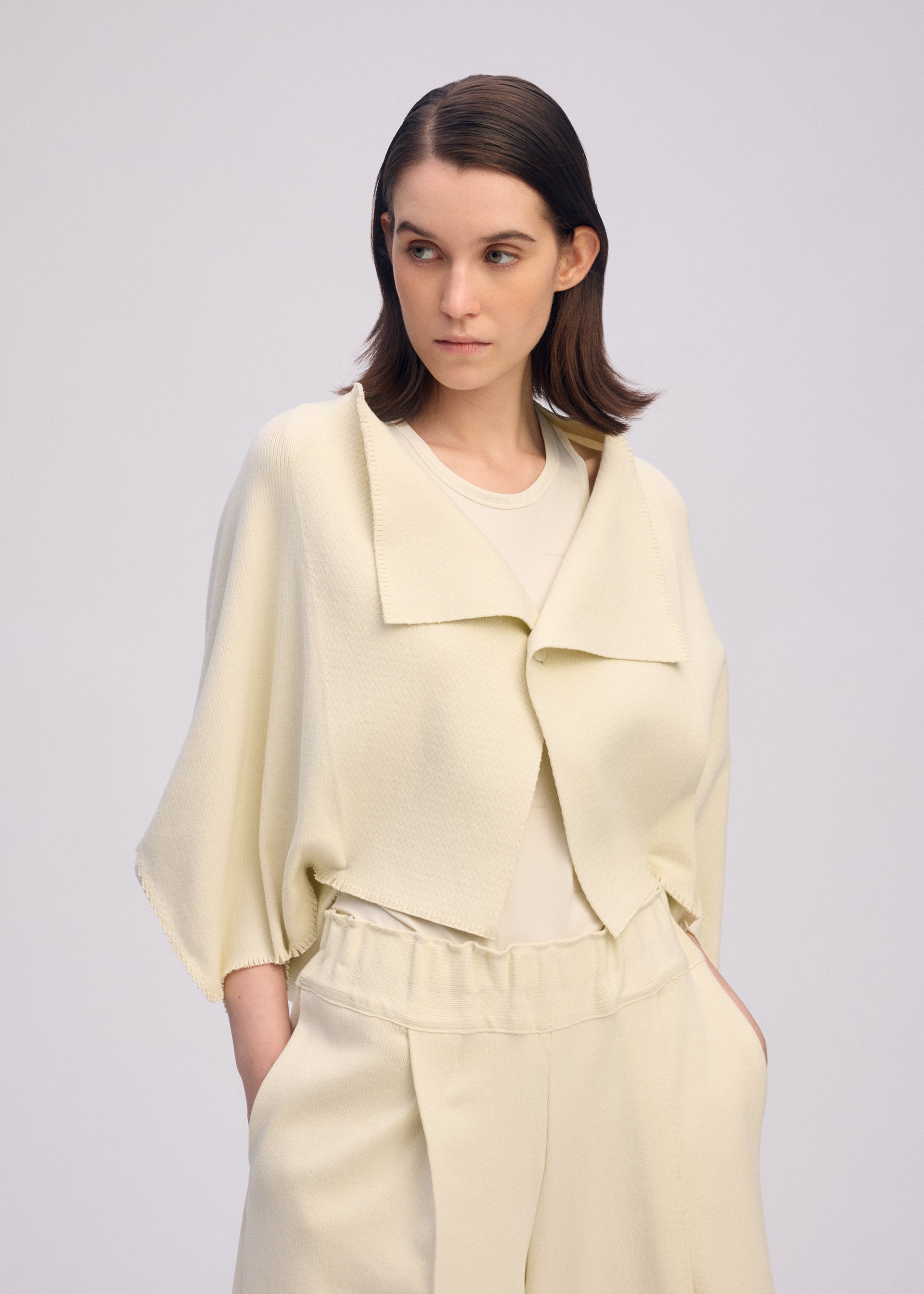 A model wears the ISSEY MIYAKE CAMPAGNE prêt à porter.