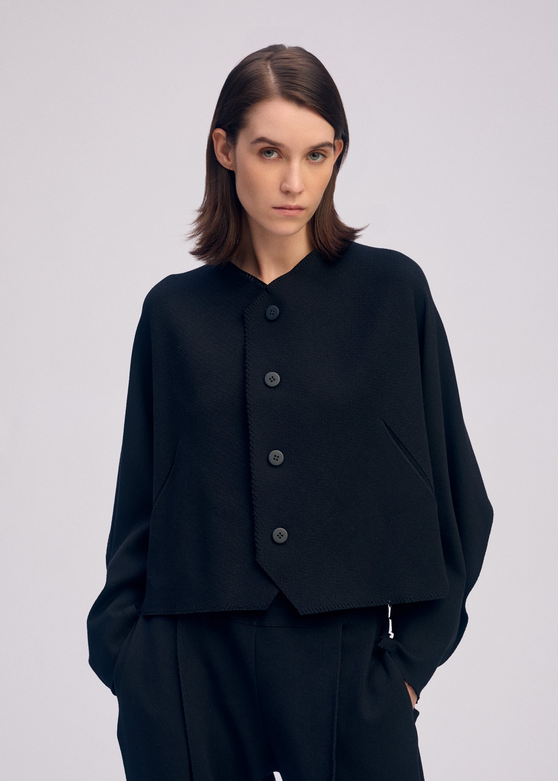 A model wears the ISSEY MIYAKE CAMPAGNE prêt à porter.