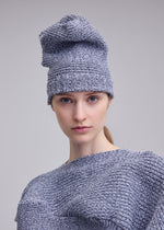 A model wears the ISSEY MIYAKE FOUND STONE BEANIE found-stone-beanie-cap-black-2.