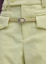 A model wears the ISSEY MIYAKE SOLID LEATHER BELT solid-leather-belt-belt-black-fw26.