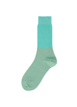 A product shot of the ISSEY MIYAKE SHEER RIB SOCKS socks in light blue.